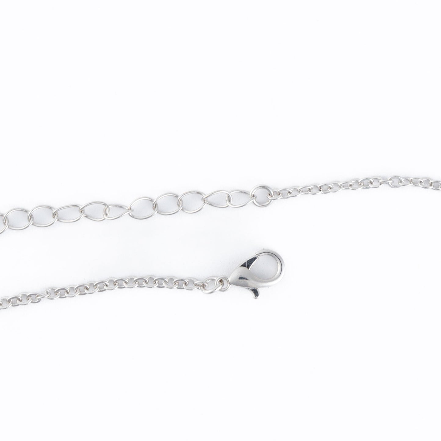 A silver lobster clasp necklace closure