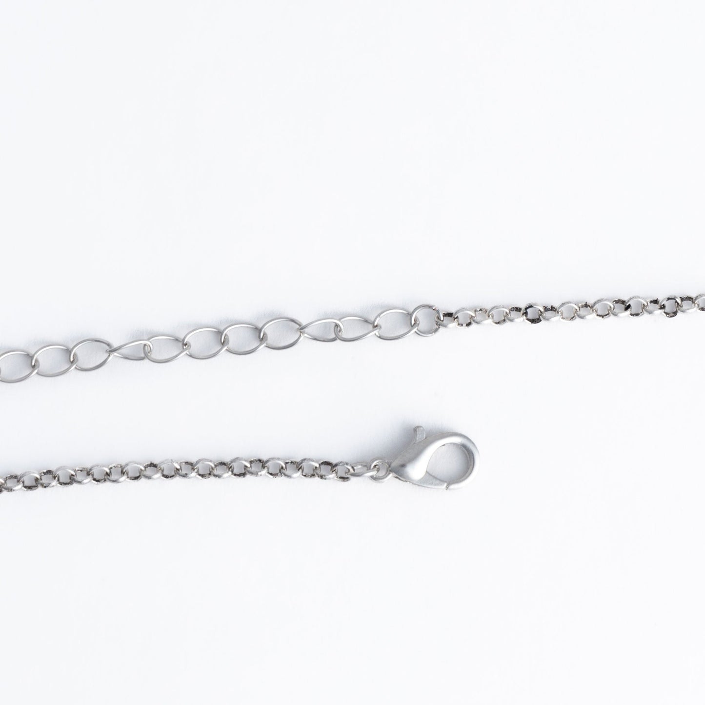 a silver pendant necklace closure