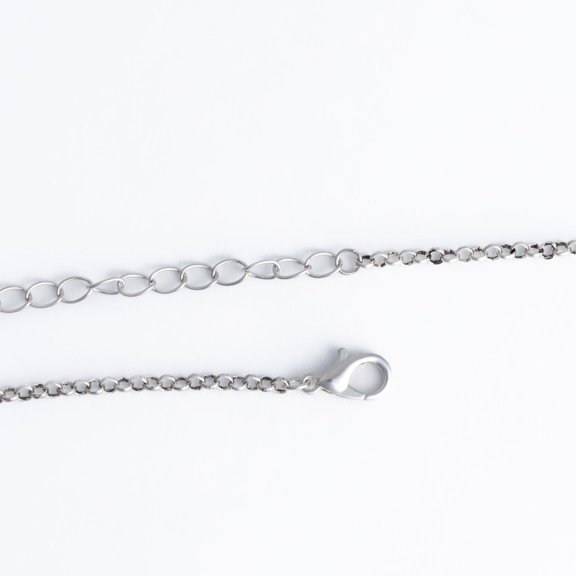 a silver pendant necklace closure