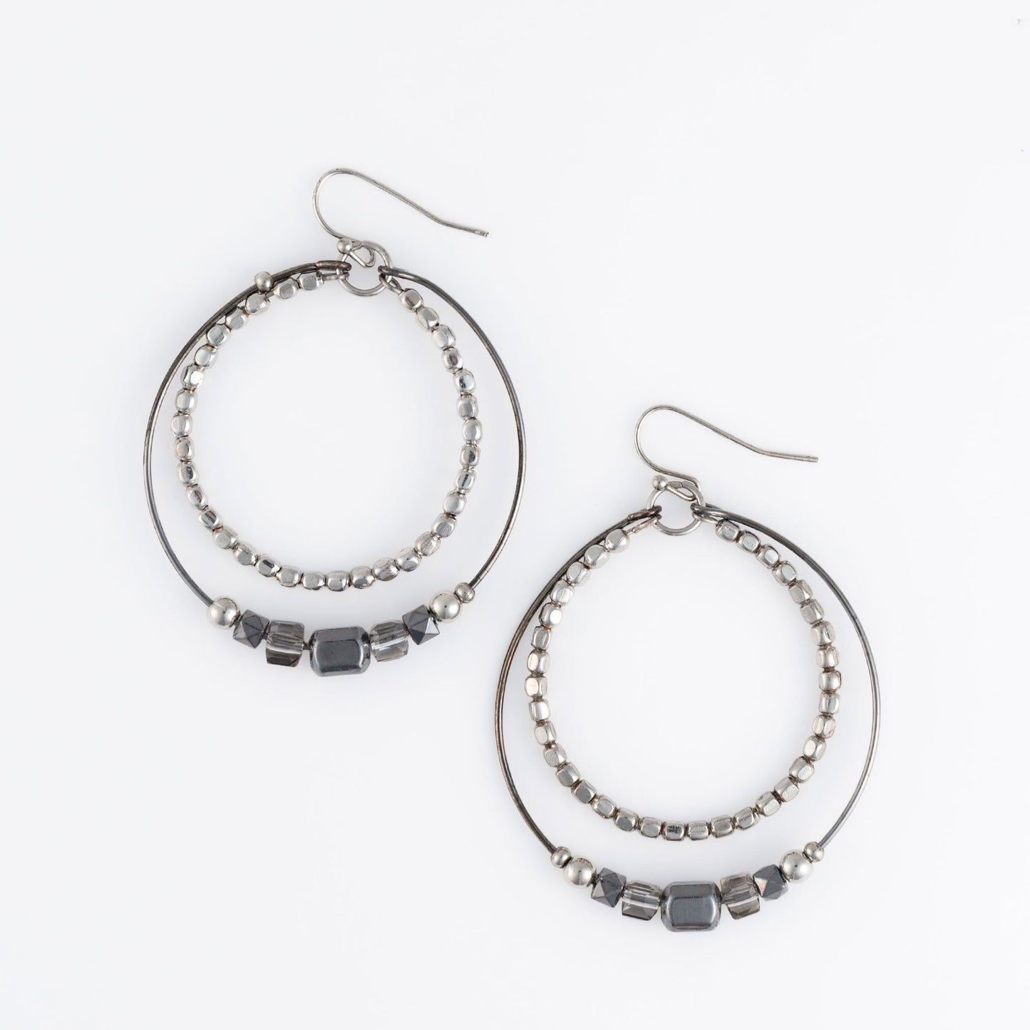 A pair of beaded earrings with two interlaced hoops and hematite beads.