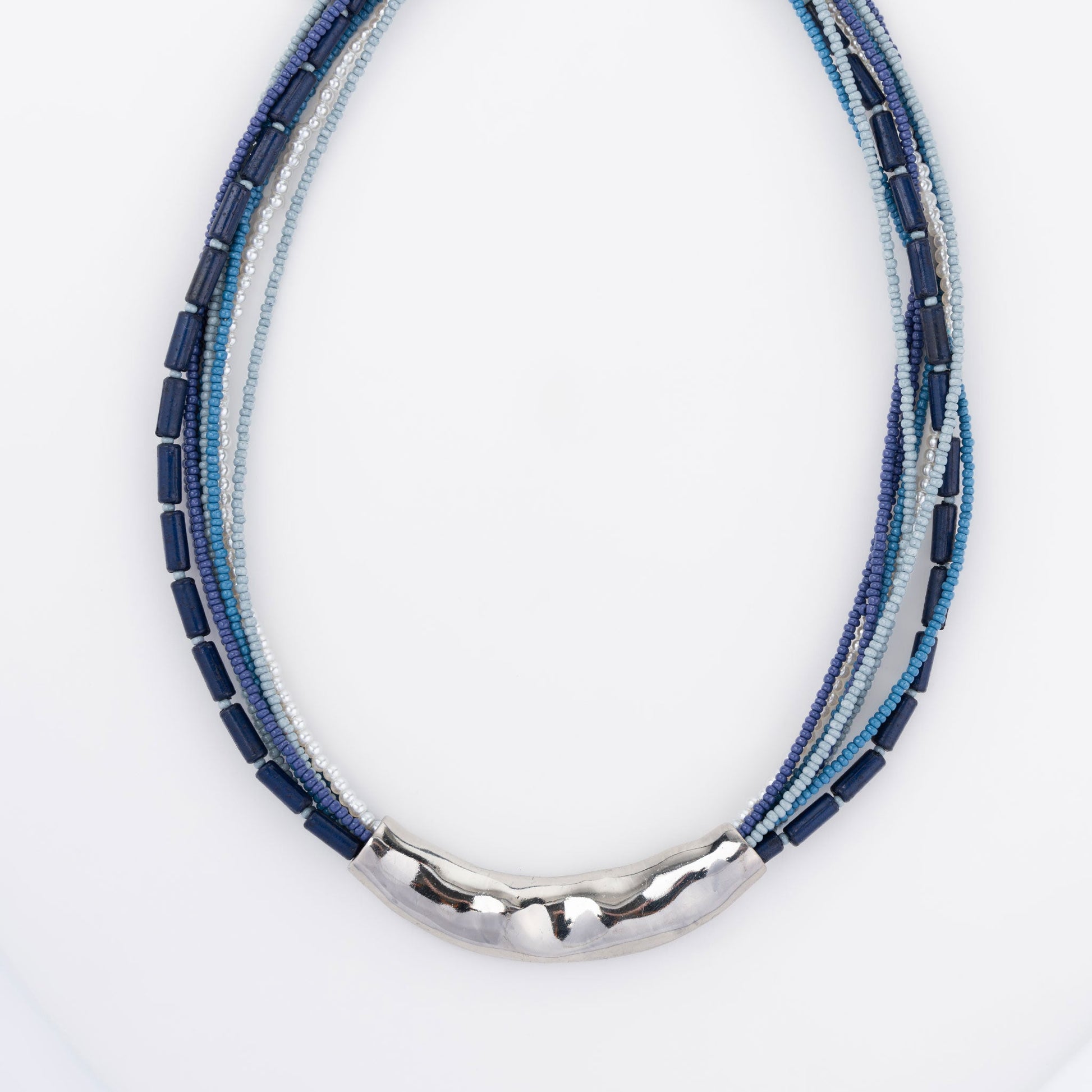 A blue seed bead necklace with silver hammered detailing