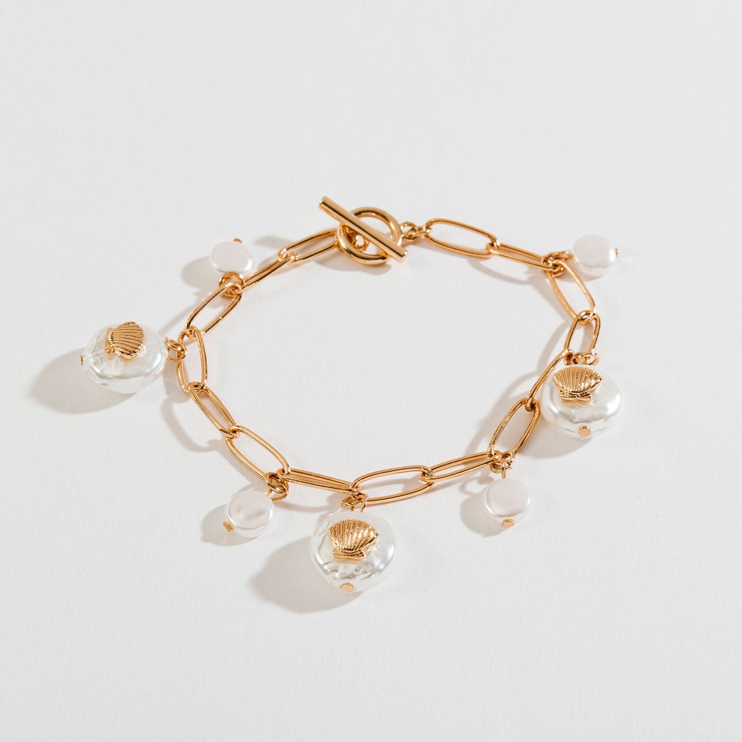 Gold Pearl And Shell Charm Bracelet