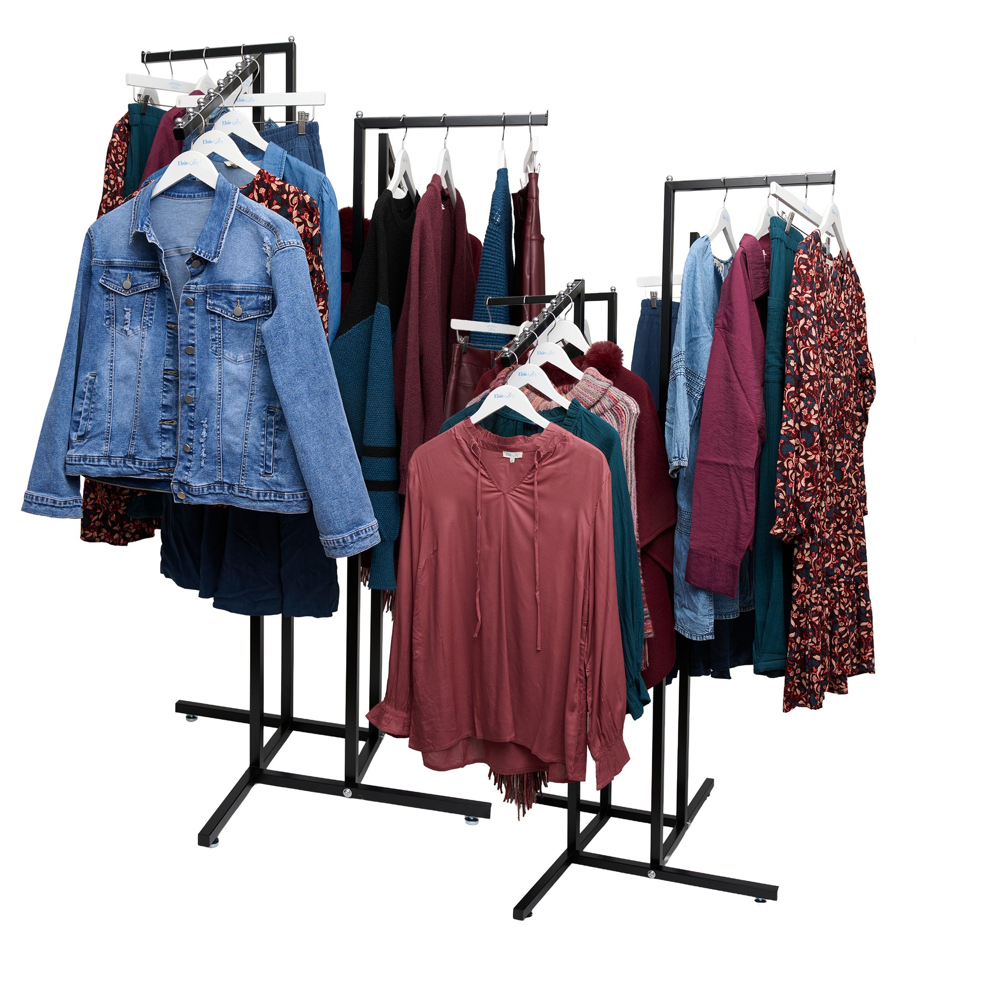 Clothing rack with various garments including a denim jacket and colorful dresses on a white background