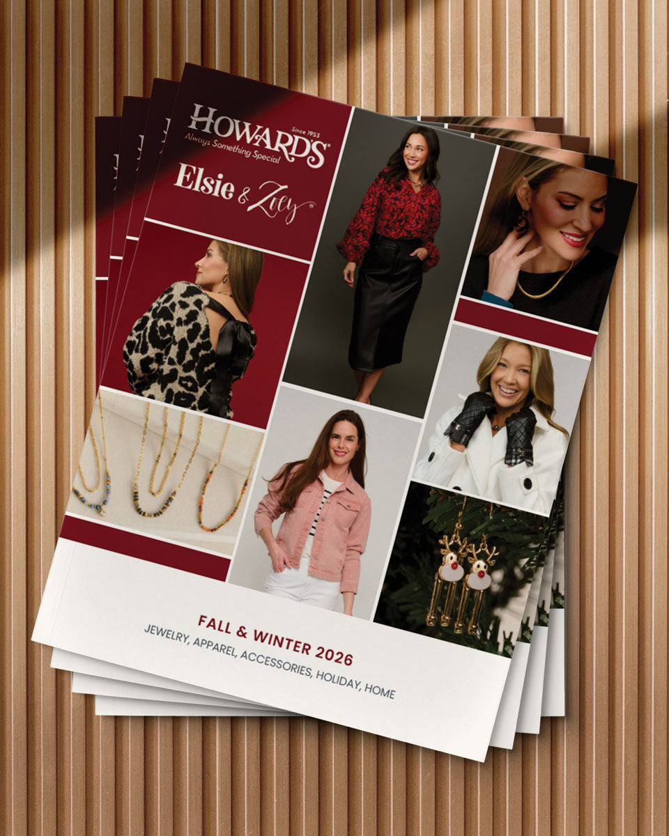 Howard's Fall & Winter 2026 catalog on a wooden surface